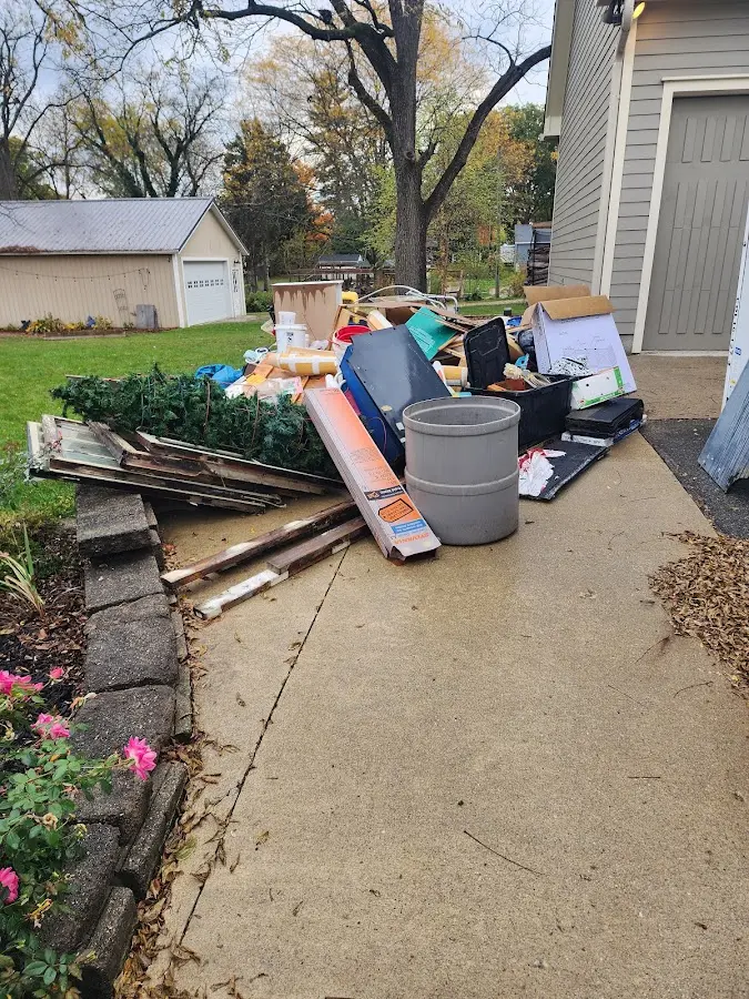 Dumpster being loaded with debris for 3 Yard Dumpster Rental in Los Angeles